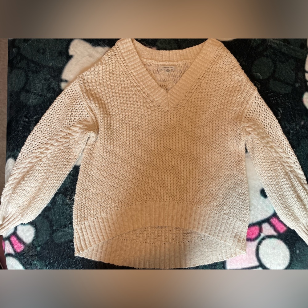 A comfortable cream color knit sweater